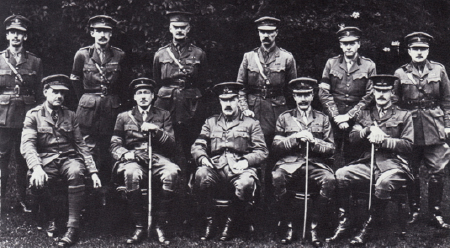 GHQ intelligence staff. Major Stewart Menzies is standing second from the left, and Major James Marshall-Cornwell on the extreme right. Brigadier General Charteris is seated in the middle